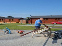 Man building a Lodge
