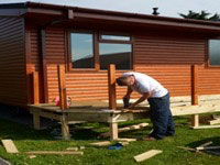 Man building a Lodge