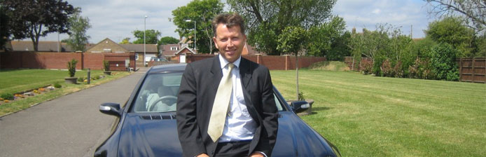 Man leaning on car